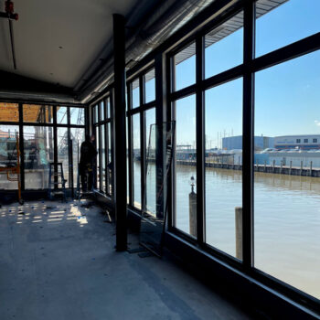 Installing Glass Windows on Riverfront Restaurant